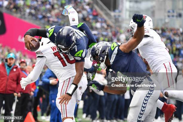 Geno Smith of the Seattle Seahawks dives for the end zone but is stopped short during the third quarter of the game against the Arizona Cardinals at...