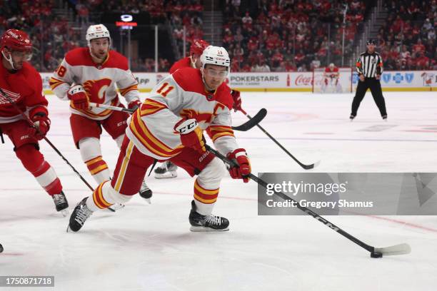 Mikael Backlund of the Calgary Flames looks for open ice in the first period while playing the Detroit Red Wings at Little Caesars Arena on October...