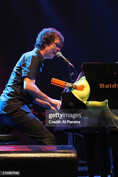 Ben Folds of The Ben Folds Five performs with bras and panties that have been tossed on stage when the Barenaked Ladies headline a benefit concert...