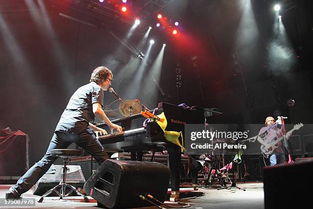 Ben Folds of The Ben Folds Five performs with bras and panties that have been tossed on stage when the Barenaked Ladies headline a benefit concert...