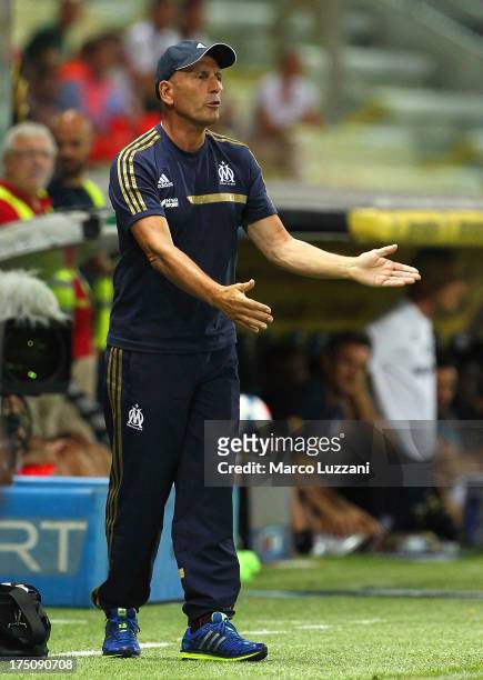 Olympique de Marseille manager Elie Baup issues instructions to his players during the pre-season friendly match between Parma FC and Olympique de...