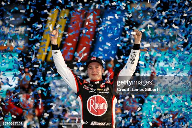 Christopher Bell, driver of the Rheem/Watts Toyota, celebrates in victory lane after winning the NASCAR Cup Series 4EVER 400 Presented by Mobil 1 at...