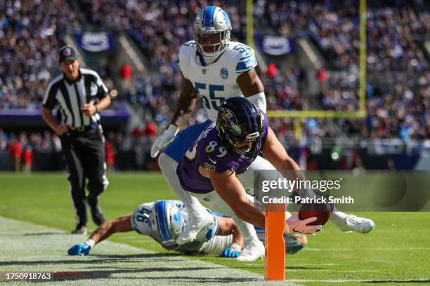 Mark Andrews of the Baltimore Ravens scores a touchdown against the Detroit Lions during the second quarter at M&T Bank Stadium on October 22, 2023...