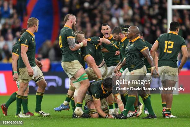 The players of South Africa celebrate as Referee Ben O’Keeffe awards a penalty from the scrum during the Rugby World Cup France 2023 match between...