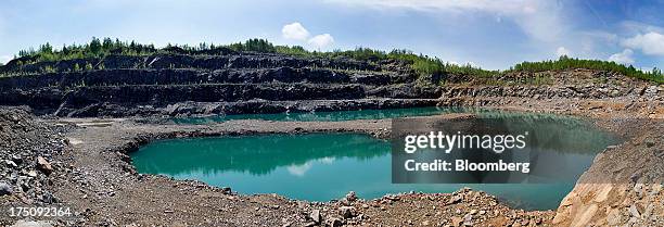 Water sits in an unused open pit mine at Ontario Graphite Ltd.'s Kearney Mine facility in Kearney, Ontario, Canada, on Thursday, May 30, 2013. The...