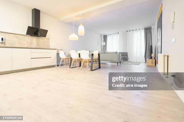 side view of a living room in an apartment with tv hanging in the kitchen, no people. - facing front stock pictures, royalty-free photos & images