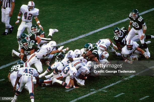 New York Jets Mark Gastineau and Freeman McNeil in action vs Miami Dolphins at Orange Bowl Stadium. Miami, FL CREDIT: George Tiedemann