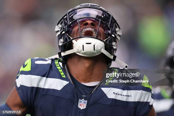 Devon Witherspoon of the Seattle Seahawks reacts to a play during the fourth quarter of the game against the Arizona Cardinals at Lumen Field on...