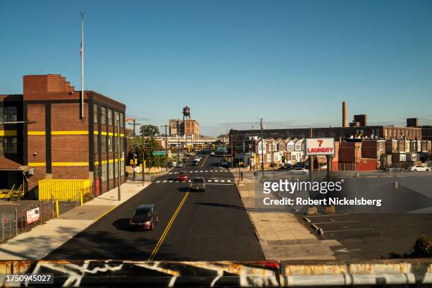 Gentrified urban industrial area is seen from an Amtrak train bridge October 18, 2023 in Philadelphia, Pennsylvania