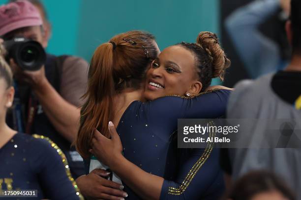 Jade Barbosa of Team Brazil greats teammate Rebeca Andrade after competing in the Women's Team Final at Parque Deportivo Estadio Nacional on Day 2 of...