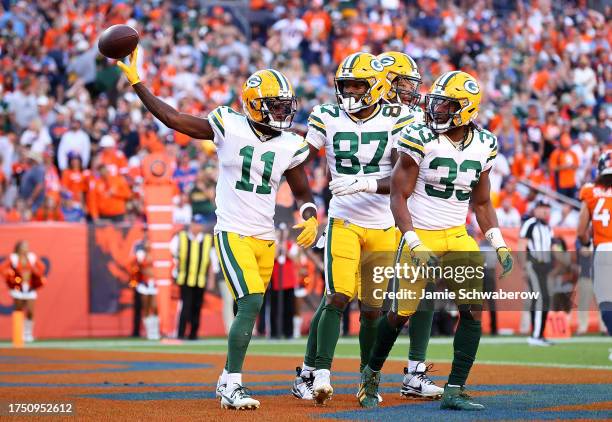 Jayden Reed of the Green Bay Packers celebrates after scoring a touchdown in the fourth quarter of the game against the Denver Broncos at Empower...