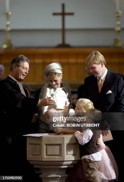 Dutch Crown Prince Willem-Alexander and Princess Maxima hold their youngest daughter Princess Ariane during her baptism ceremony by Reverend Deodaat...