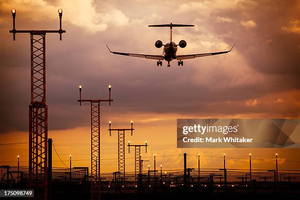 aeroplane arriving at manchester airport - manchester airport stock pictures, royalty-free photos & images