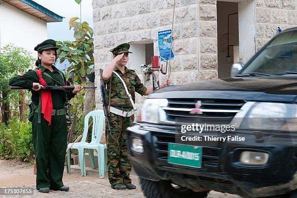 Women soldiers from the Kachin Independence Army guard the entrance of the army's headquarters. With its 6,000 troops, the KIA is one of the best...