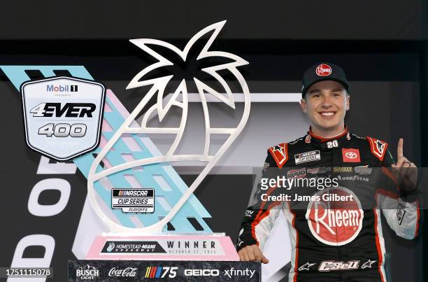 Christopher Bell, driver of the Rheem/Watts Toyota, celebrates in victory lane after winning the NASCAR Cup Series 4EVER 400 Presented by Mobil 1 at...