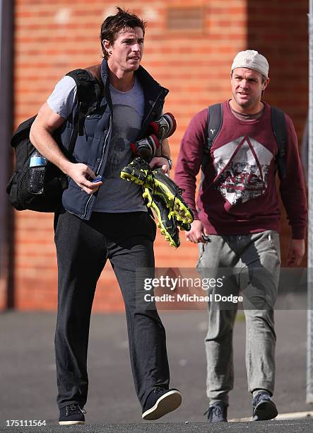 Lenny Hayes and Adam Schneider leave a St Kilda Saints AFL training session at Moorabbin Oval on August 1, 2013 in Melbourne, Australia.