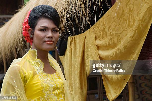 Zaw Moe, a medium, in a ceremonial dress before a dance at Taungbyon festival. Every year in August, hundreds of thousands of people from all over...