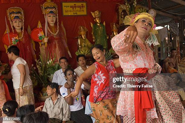 Medium dances in one of the numerous shrines dedicated to the nats during the Taungbyon festival. Every year in August, hundreds of thousands of...