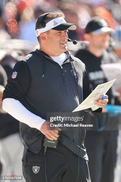 Head coach Josh McDaniels of the Las Vegas Raiders looks on against the Chicago Bears at Soldier Field on October 22, 2023 in Chicago, Illinois.