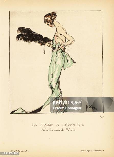 Lady with a feather fan in an evening dress by Worth. Green and silver damask decorated with silver lace and diamonds. La Femme a l’eventail. De...