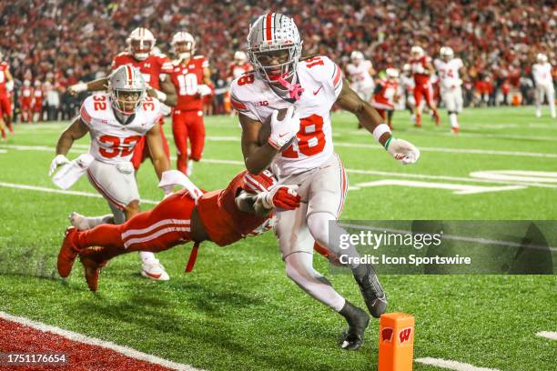 Ohio State wide receiver Marvin Harrison Jr. Runs into the end zone for the first Ohio Sate touchdown during a college football game between the...