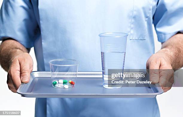 nurse bringing medication - serving tray stock pictures, royalty-free photos & images