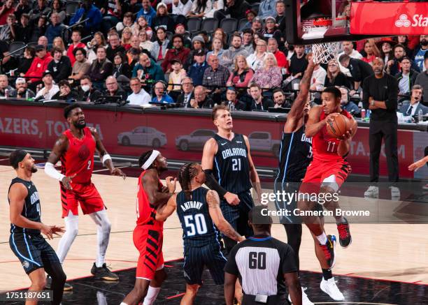 Malcolm Brogdon of the Portland Trail Blazers looks to pass the ball during the game against the Orlando Magic on October 27, 2023 at the Portland...