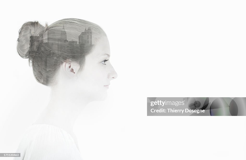 Multiple exposure of a woman and New York City