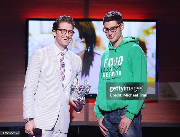 Matthew Morrison and Ben Simon speak onstage during the 2013 Do Something Awards held at Avalon on July 31, 2013 in Hollywood, California.