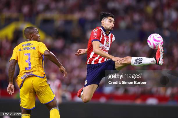 Ricardo Marin of Chivas controls the ball ahead of Samir De Souza of Tigres during the 14th round match between Chivas and Tigres UANL as part of the...