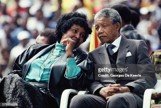 African National Congress leader Nelson Mandela and his wife Winnie Mandela attend a rally in Soweto on February 13, 1990 in Johannesburg, South...