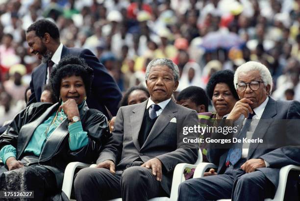 Winnie Mandela, African National Congress leader Nelson Mandela and general secretary Walter Sisulu attend a rally in Soweto on February 13, 1990 in...