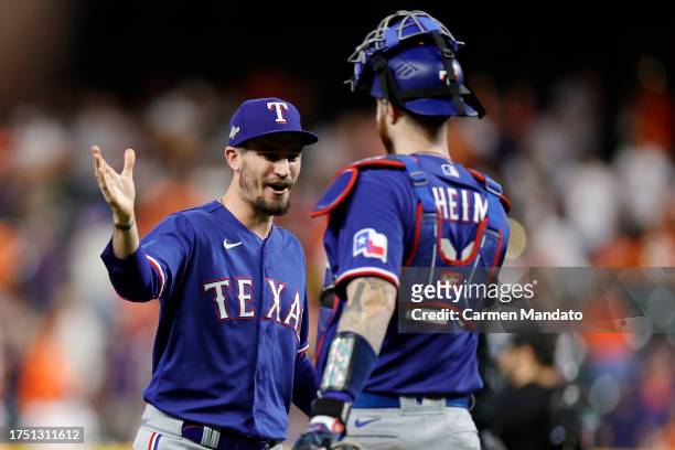 Andrew Heaney and Jonah Heim of the Texas Rangers celebrates after defeating the Houston Astros in Game Six of the American League Championship...
