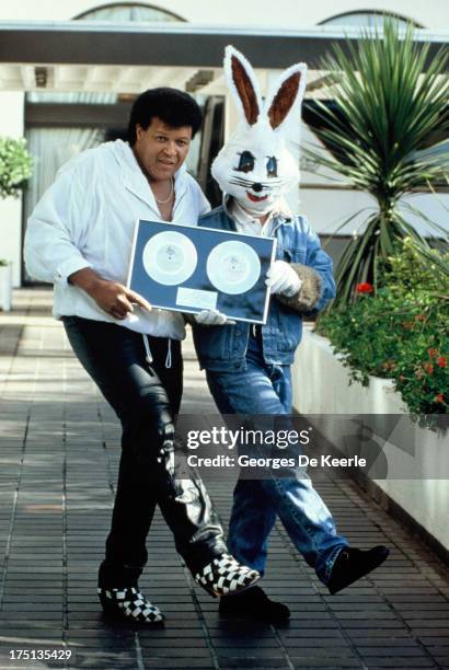 American singer-songwriter Chubby Checker with Jive Bunny on October 25, 1989 in London, England. Jive Bunny & The Mastermixers had produced a...