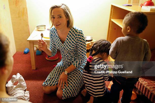 German Family Minister Kristina Schroeder chats with children and employees while visiting the TDKG Turkish-German Kindergarten on the day a new law...