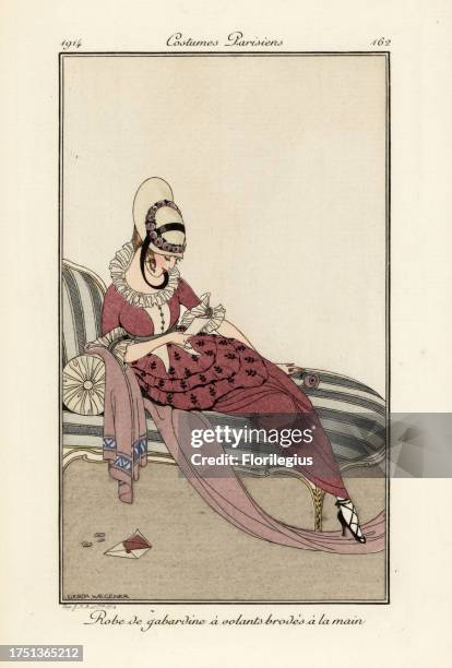 Woman in gaberdine dress with hand-embroidered frills, sitting on a chaise longue. Robe de gabardine a volants brodes a la main. Handcoloured pochoir...