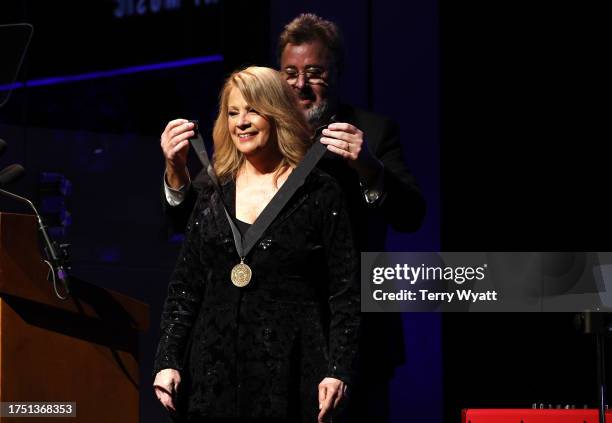 Honoree, Patty Loveless and Vince Gill seen onstage during the Class of 2023 Medallion Ceremony at Country Music Hall of Fame and Museum on October...