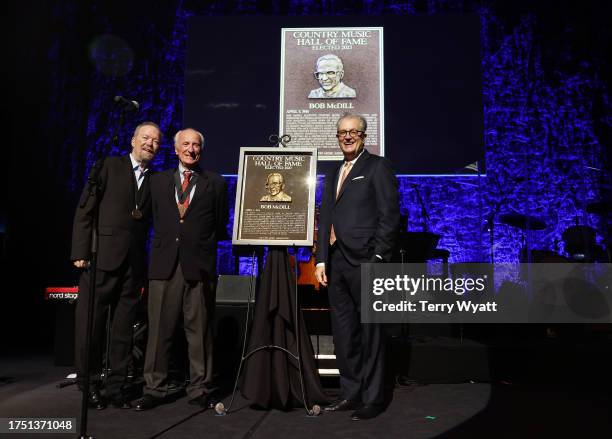 Don Schlitz, Honoree Bob McDill and Country Music Hall of Fame and Museum CEO Kyle Young seen onstage during the Class of 2023 Medallion Ceremony at...