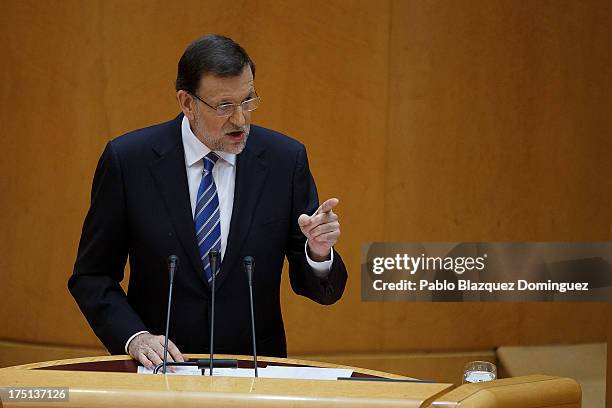Spanish Prime Minister Mariano Rajoy speaks during Parliament session over allegations on corruption scandals at the Senade Building on August 1,...