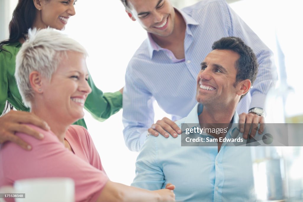 Business people laughing in meeting