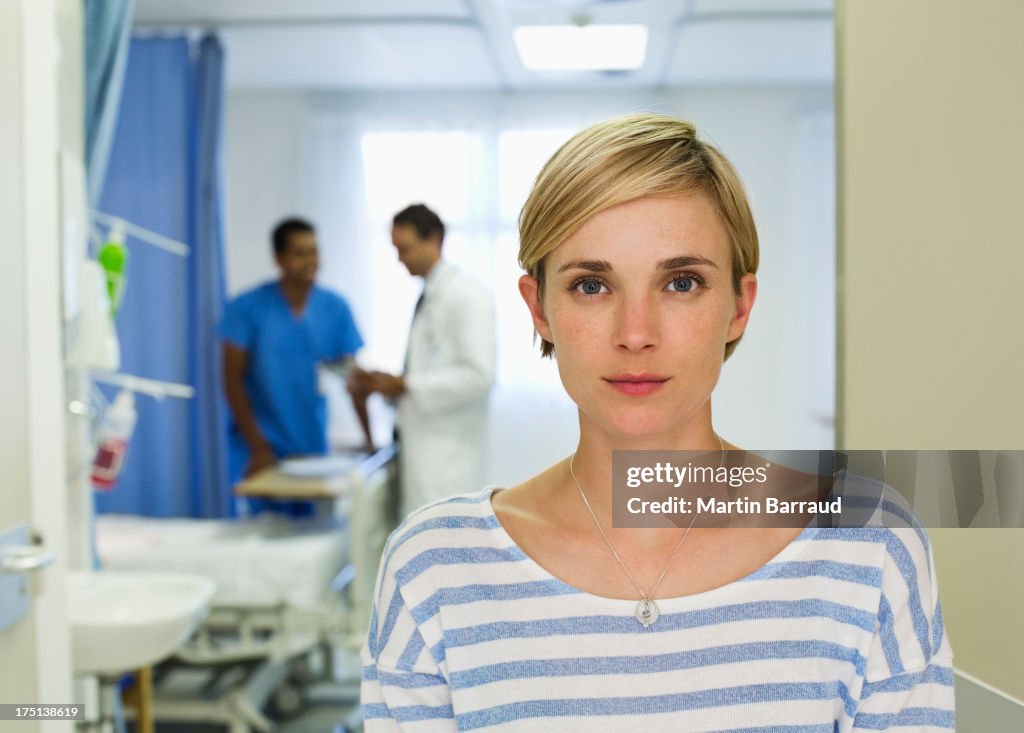 Patient standing in hospital room