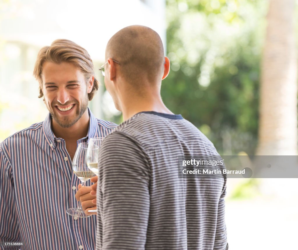 Men drinking wine together