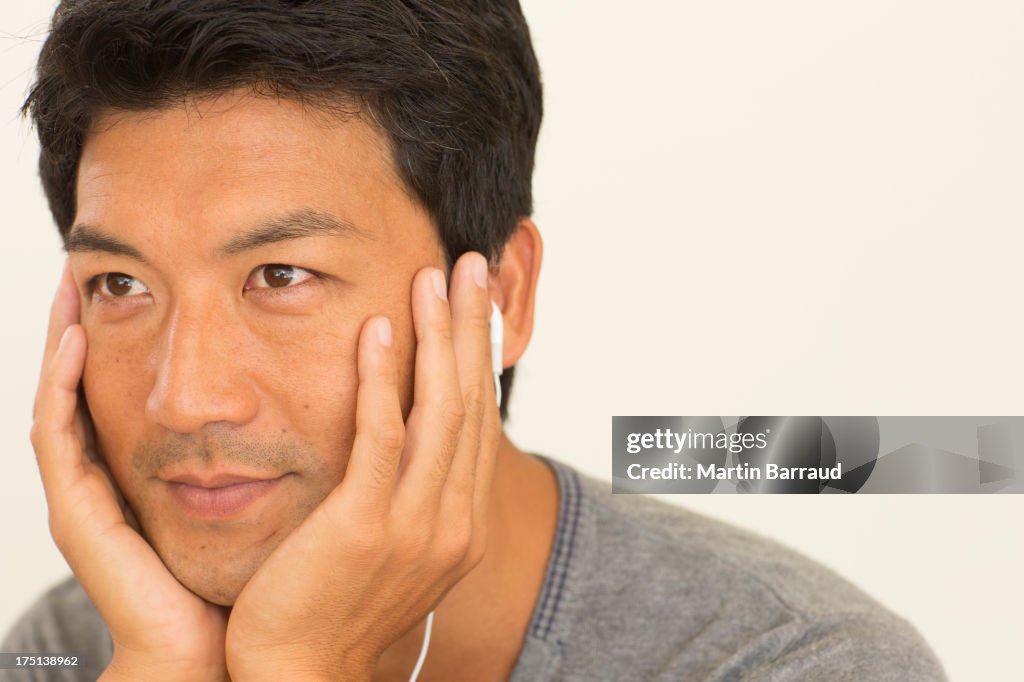 Man resting chin in hands