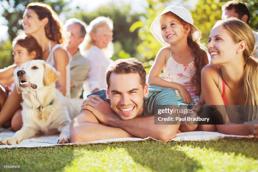 Family relaxing in backyard