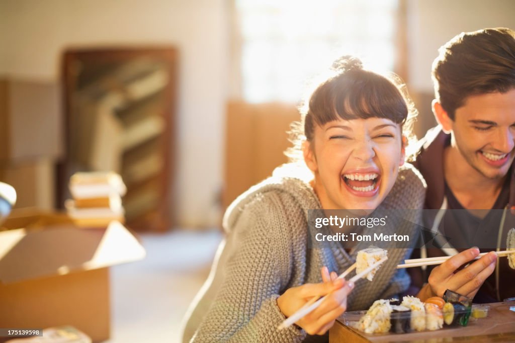 Couple eating sushi together