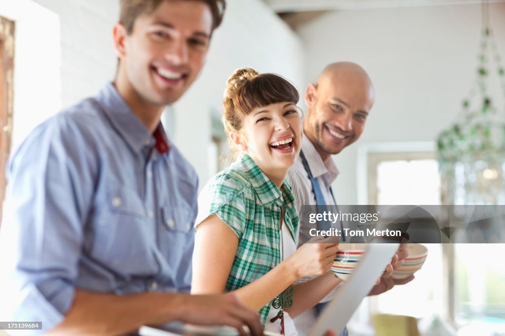 Friends having breakfast together in kitchen