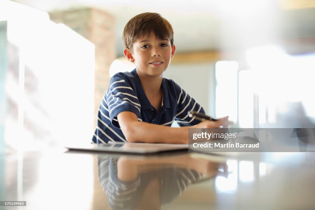 Boy doing homework at counter