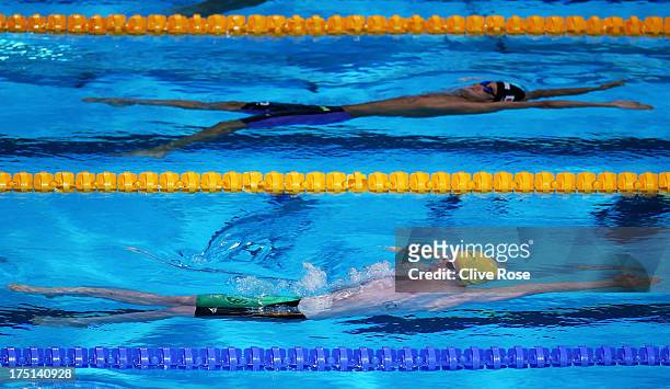 Ryosuke Irie of Japan and Matson Lawson of Australia compete during the Swimming Men's 200m Backstroke preliminaries heat three on day thirteen of...