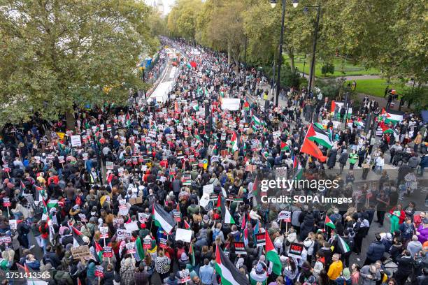 Tens of thousands of pro-Palestinian protesters march on the street during the demonstration urging an end to Israel's attacks in Gaza. Thousands...