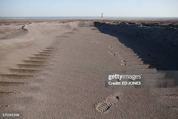 Photo taken on August 19, 2012 shows a general view of a 'toxic lake' surrounded by rare earth refineries near the inner Mongolian city of Baotou. On...